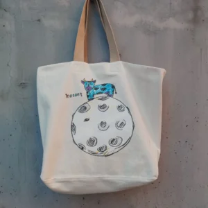 Natural canvas tote bag with hand-drawn cow on the moon and "Moooon" text — Mooon by gumi-gumi